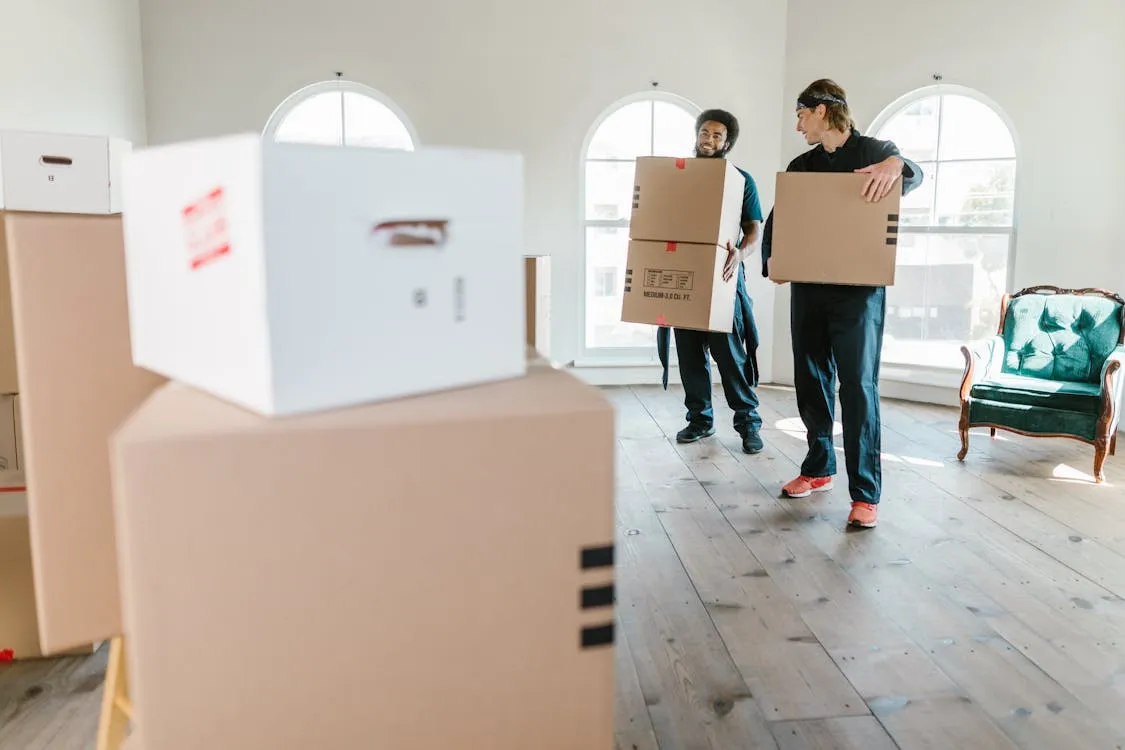 Two removalists loading a truck in Brisbane